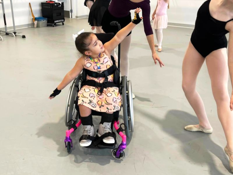 Little girl in wheelchair in dance class